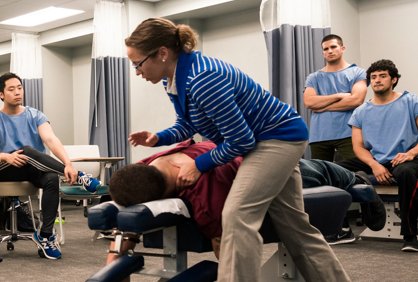 Northeast Professor demonstrating chiropractic technique